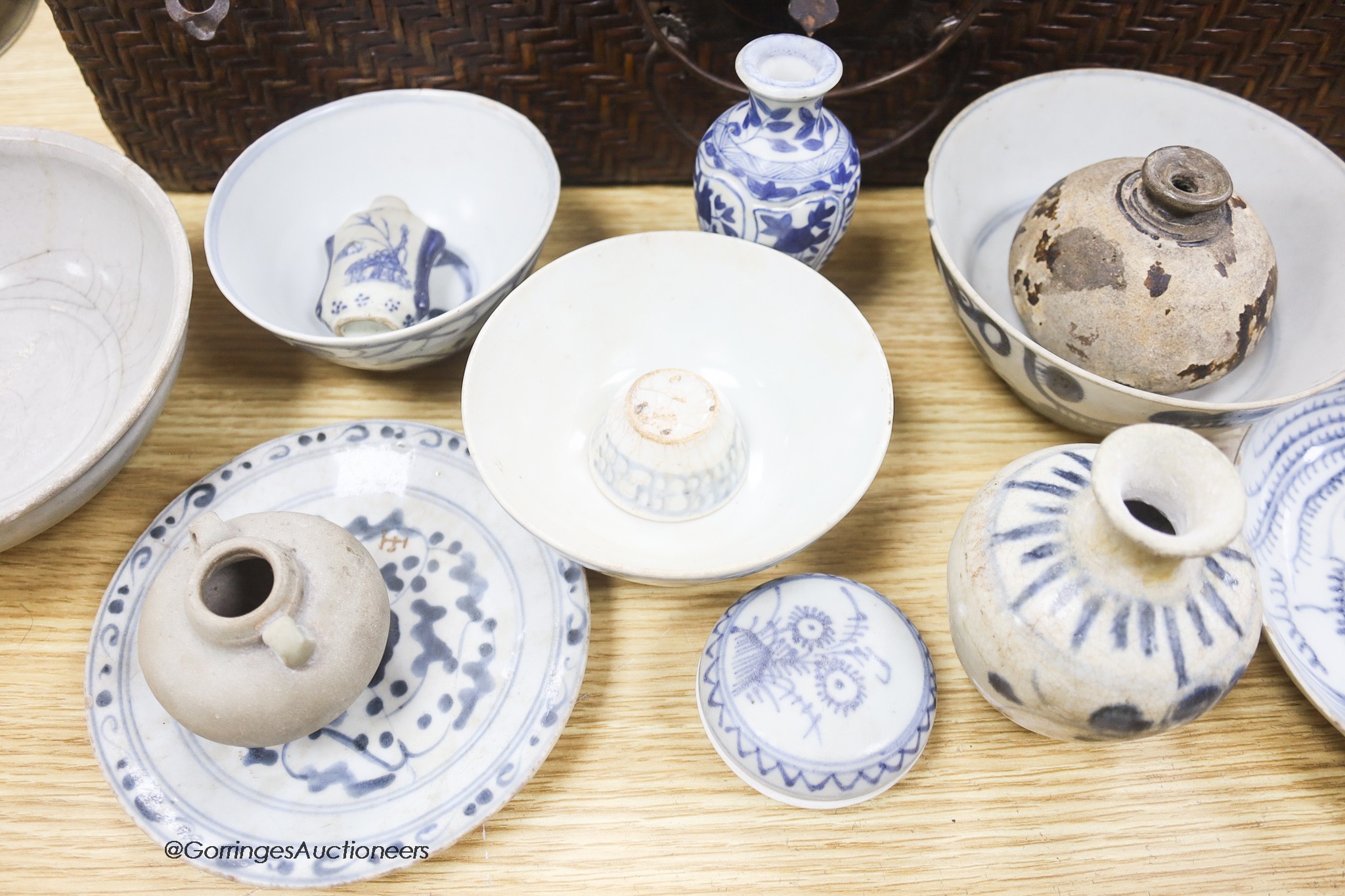 A collection of Chinese and Annamese shipwreck ceramics, Song to 19th century including bowls and vases, together with two graduated wicker baskets